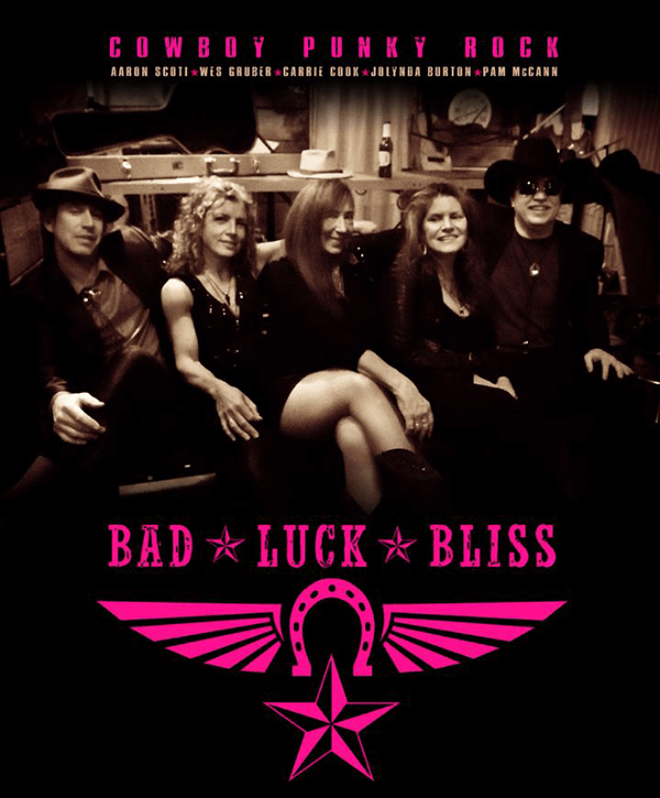 Bad Luck Bliss five band members sitting on a couch