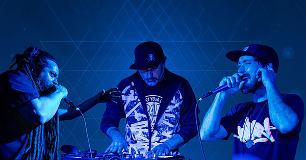 Two people singing with a DJ